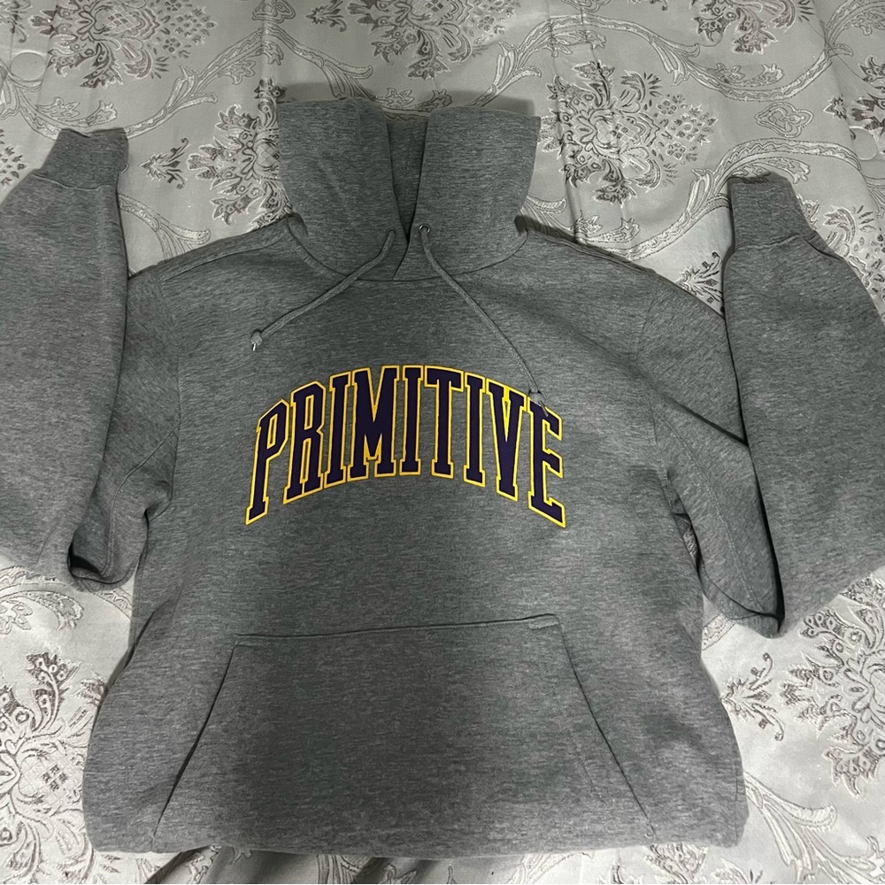 primitive grey hoodie with purple/yellow letters